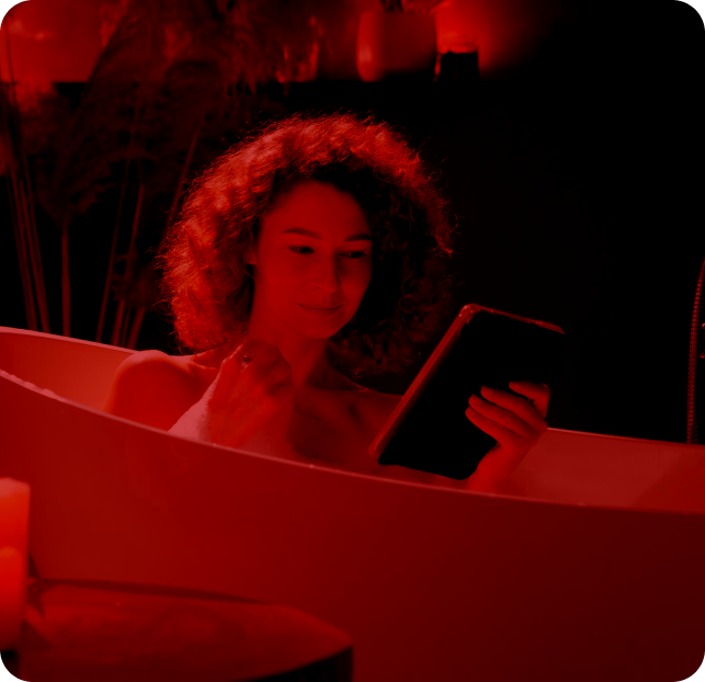 Woman reading in bathtub
